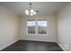 Dining room with dark floors and large windows at 3809 Carl Parmer Dr, Harrisburg, NC 28075