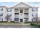 Three-story building exterior with balconies and a walkway at 3809 Carl Parmer Dr, Harrisburg, NC 28075