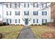 Two-story building exterior with blue shutters and a walkway at 3809 Carl Parmer Dr, Harrisburg, NC 28075
