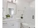 Modern bathroom with white subway tiles, glass-enclosed shower, and sleek vanity with a stylish mirror at 421 Delburg Mill Alley Dr, Davidson, NC 28036