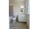 Bathroom with single sink vanity, modern lighting, and tiled shower at 421 Delburg Mill Alley Dr, Davidson, NC 28036