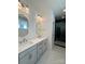 Modern bathroom with double sink vanity, quartz countertop, and tiled shower at 421 Delburg Mill Alley Dr, Davidson, NC 28036