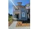 Charming two-story home with a covered front porch and manicured landscaping at 421 Delburg Mill Alley Dr, Davidson, NC 28036