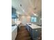 Spacious kitchen featuring a center island, stainless steel appliances, and custom lighting at 421 Delburg Mill Alley Dr, Davidson, NC 28036