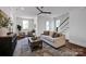 Spacious living room with hardwood floors, modern furnishings, and a staircase leading to the upper level at 421 Delburg Mill Alley Dr, Davidson, NC 28036