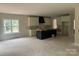 Spacious kitchen under construction featuring white and black cabinets and a black vent hood at 426 Richards Ln, Mooresville, NC 28115