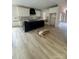 Modern kitchen featuring a large black island, stylish white cabinets, and an open layout with new flooring at 426 Richards Ln, Mooresville, NC 28115