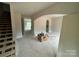 Unfinished living room featuring an arched entryway, doorway, and staircase with natural light at 426 Richards Ln, Mooresville, NC 28115