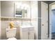 Bathroom featuring marble-look tile, modern vanity with glass bowl sink, and updated fixtures at 4926 Nc Highway 109 South, Mount Gilead, NC 27306
