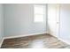 Empty bedroom features hardwood floors, a window for natural light, and neutral paint at 4926 Nc Highway 109 South, Mount Gilead, NC 27306