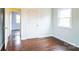 Empty bedroom features hardwood floors, a window for natural light, and neutral paint at 4926 Nc Highway 109 South, Mount Gilead, NC 27306