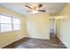 A bedroom with ample sunlight offers a relaxing retreat with hardwood floors and a calming ambiance at 4926 Nc Highway 109 South, Mount Gilead, NC 27306