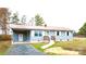 Welcoming home with light blue siding, a red roof, a convenient carport, and a concrete walkway at 4926 Nc Highway 109 South, Mount Gilead, NC 27306