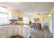 Cozy kitchen and dining space with stainless steel appliances, hardwood floors, and ample natural light at 4926 Nc Highway 109 South, Mount Gilead, NC 27306