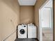 Functional laundry room featuring a washing machine and dryer at 4926 Nc Highway 109 South, Mount Gilead, NC 27306