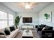 Inviting living room featuring neutral decor, modern furnishings, and ample natural light at 4926 Nc Highway 109 South, Mount Gilead, NC 27306
