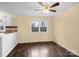 Bright living room with hardwood floors and a ceiling fan provides comfort and style for relaxation and entertainment at 4926 Nc Highway 109 South, Mount Gilead, NC 27306