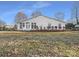 House exterior showcasing sunroom and fenced backyard at 500 Kirby Ln, Matthews, NC 28104