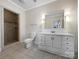 Bathroom with updated vanity, shower, and tile floors at 500 Kirby Ln, Matthews, NC 28104