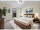 Virtually staged main bedroom with wood platform bed at 500 Kirby Ln, Matthews, NC 28104