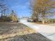 Ranch home with attached two-car garage and long driveway at 500 Kirby Ln, Matthews, NC 28104