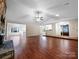 Open concept living space with hardwood floors and kitchen views at 500 Kirby Ln, Matthews, NC 28104