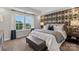 Spacious bedroom with patterned wall and comfy bedding at 5029 Westmead Ln, Charlotte, NC 28262