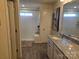 Bathroom with shower, granite vanity, and separate toilet at 5860 Clan Maclaine Dr, Charlotte, NC 28278