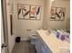Main bathroom with double sinks, toilet and decorative art at 5860 Clan Maclaine Dr, Charlotte, NC 28278