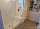 Clean bathroom with a large walk-in shower and tiled walls at 5860 Clan Maclaine Dr, Charlotte, NC 28278
