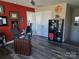 Home office featuring built-in shelving and hardwood floors at 5860 Clan Maclaine Dr, Charlotte, NC 28278