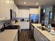 Modern kitchen with stainless steel appliances and white cabinetry at 5860 Clan Maclaine Dr, Charlotte, NC 28278
