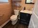 Modern powder room with dark vanity and unique wallcovering at 5860 Clan Maclaine Dr, Charlotte, NC 28278