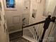 Elegant staircase with decorative mirrors and picture frames at 5860 Clan Maclaine Dr, Charlotte, NC 28278