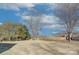 Large backyard with mature trees and wooden fence at 710 N Cedar St, Lincolnton, NC 28092