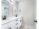 Bathroom boasts double vanity with quartz countertop at 710 N Cedar St, Lincolnton, NC 28092