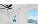 Bright bedroom with ceiling fan and two windows at 710 N Cedar St, Lincolnton, NC 28092