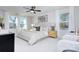 Bright bedroom with a king-size bed, two nightstands, and large windows at 710 N Cedar St, Lincolnton, NC 28092