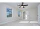 Well-lit bedroom featuring a ceiling fan and ample closet space at 710 N Cedar St, Lincolnton, NC 28092