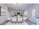 Elegant dining area with glass table and modern chairs at 710 N Cedar St, Lincolnton, NC 28092