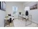 Charming home office with glass desk, comfy chair, and natural light at 710 N Cedar St, Lincolnton, NC 28092