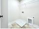 Convenient laundry room with built-in shelving at 710 N Cedar St, Lincolnton, NC 28092