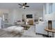 Spacious living room with plush seating, large TV, and a ceiling fan at 710 N Cedar St, Lincolnton, NC 28092