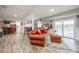 Spacious basement recreation area featuring a comfortable leather couch and sliding glass doors at 78 Honeysuckle Woods, Lake Wylie, SC 29710