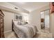 Guest bedroom with a double bed, dresser, and mirrored closet doors at 78 Honeysuckle Woods, Lake Wylie, SC 29710