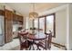 Cozy breakfast nook with wood table and chairs, overlooking the backyard at 78 Honeysuckle Woods, Lake Wylie, SC 29710