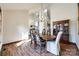 Formal dining room features hardwood floors and a charming chandelier at 78 Honeysuckle Woods, Lake Wylie, SC 29710