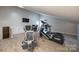 Spacious home gym, complete with cardio and strength training equipment at 78 Honeysuckle Woods, Lake Wylie, SC 29710