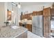 Modern kitchen with stainless steel appliances and granite countertops at 78 Honeysuckle Woods, Lake Wylie, SC 29710