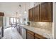 Updated kitchen features granite counters, wood cabinets, and tile backsplash at 78 Honeysuckle Woods, Lake Wylie, SC 29710